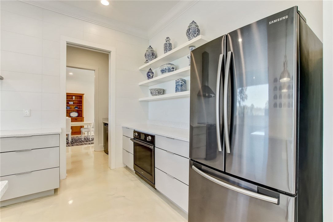 521 Bonnieview Road Fernandina Beach, FL 32034 - Photo 11 of 35 a kitchen with stainless steel appliances a refrigerator and a stove top oven