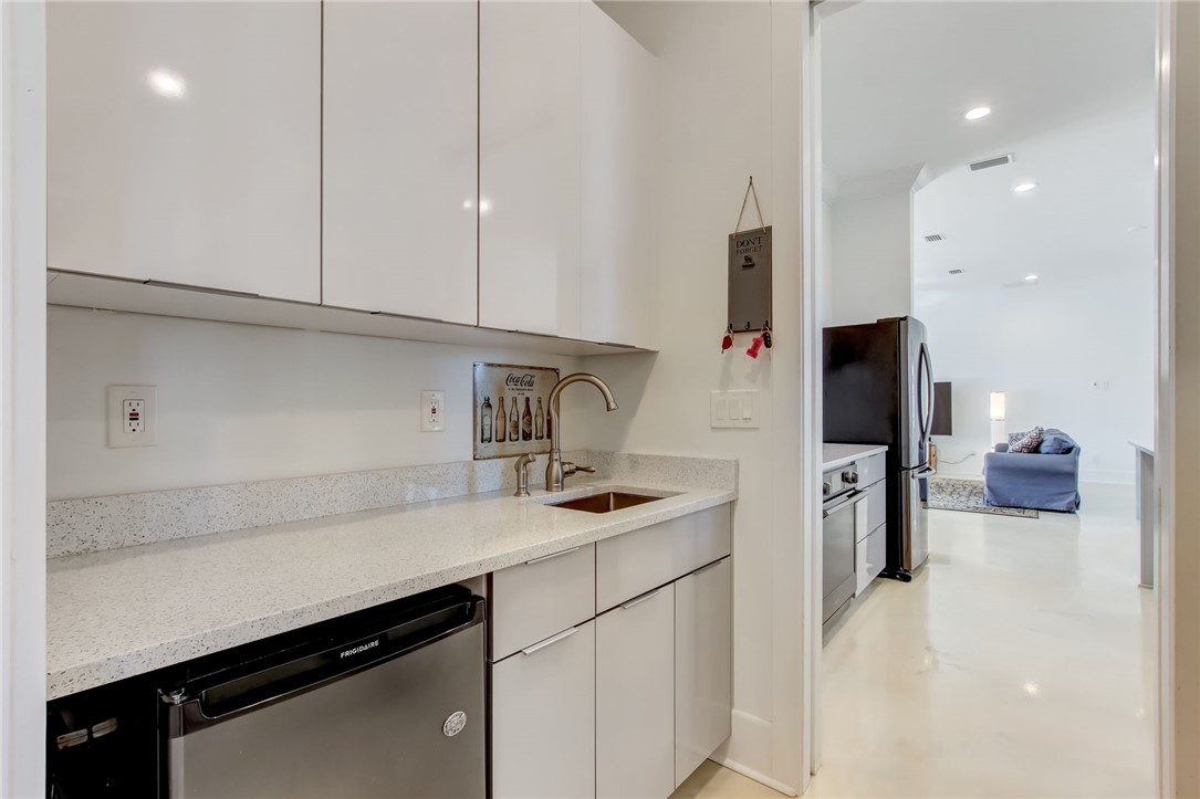 521 Bonnieview Road Fernandina Beach, FL 32034 - Photo 12 of 35 a kitchen with stainless steel appliances a sink stove and cabinets