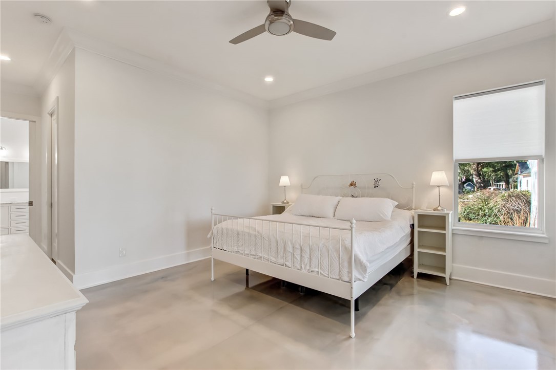 521 Bonnieview Road Fernandina Beach, FL 32034 - Photo 15 of 35 a bedroom with a bed window and a ceiling fan
