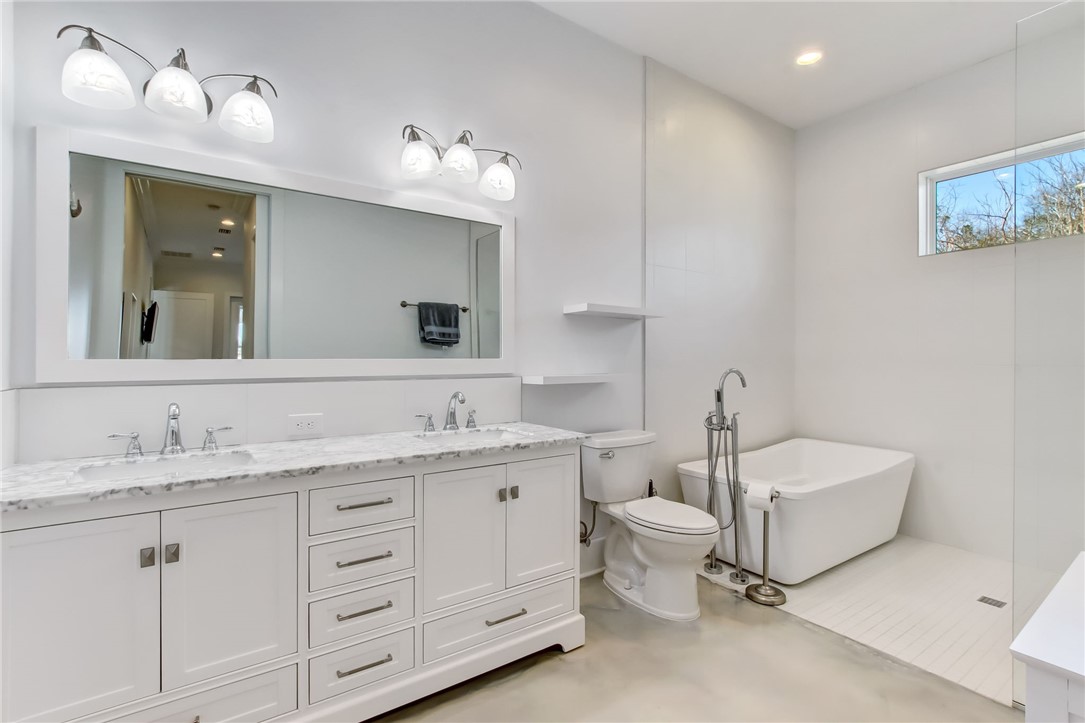 521 Bonnieview Road Fernandina Beach, FL 32034 - Photo 16 of 35 a spacious bathroom with a double vanity sink double and mirror