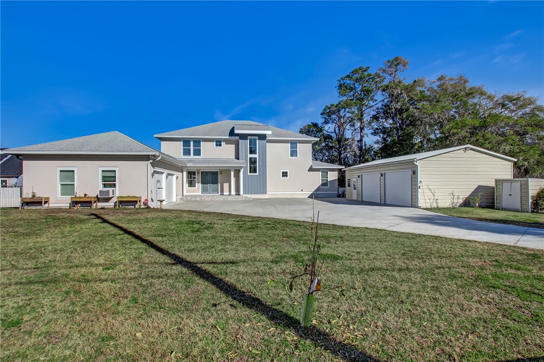 521 Bonnieview Road Fernandina Beach, FL 32034 - Photo 2 of 35 a front view of a house with garden