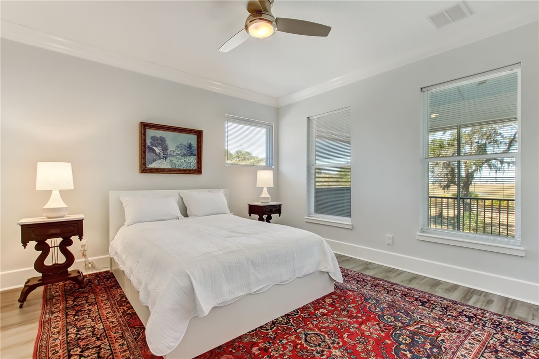 521 Bonnieview Road Fernandina Beach, FL 32034 - Photo 25 of 35 a bedroom with a bed and a window