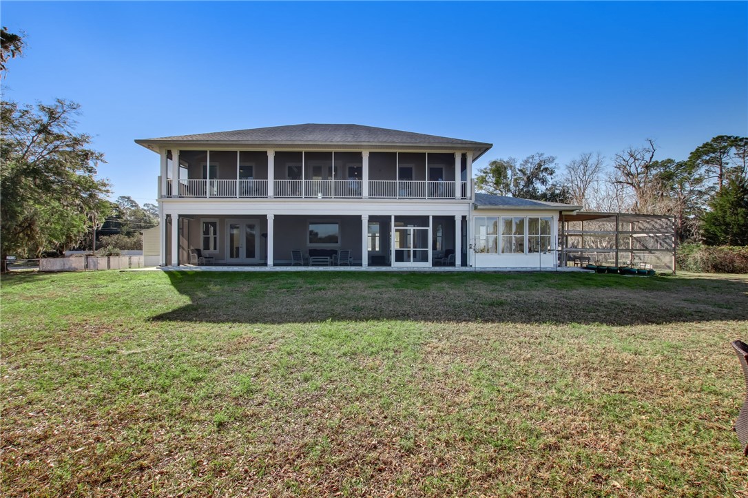 521 Bonnieview Road Fernandina Beach, FL 32034 - Photo 30 of 35 a view of house with yard and sitting area