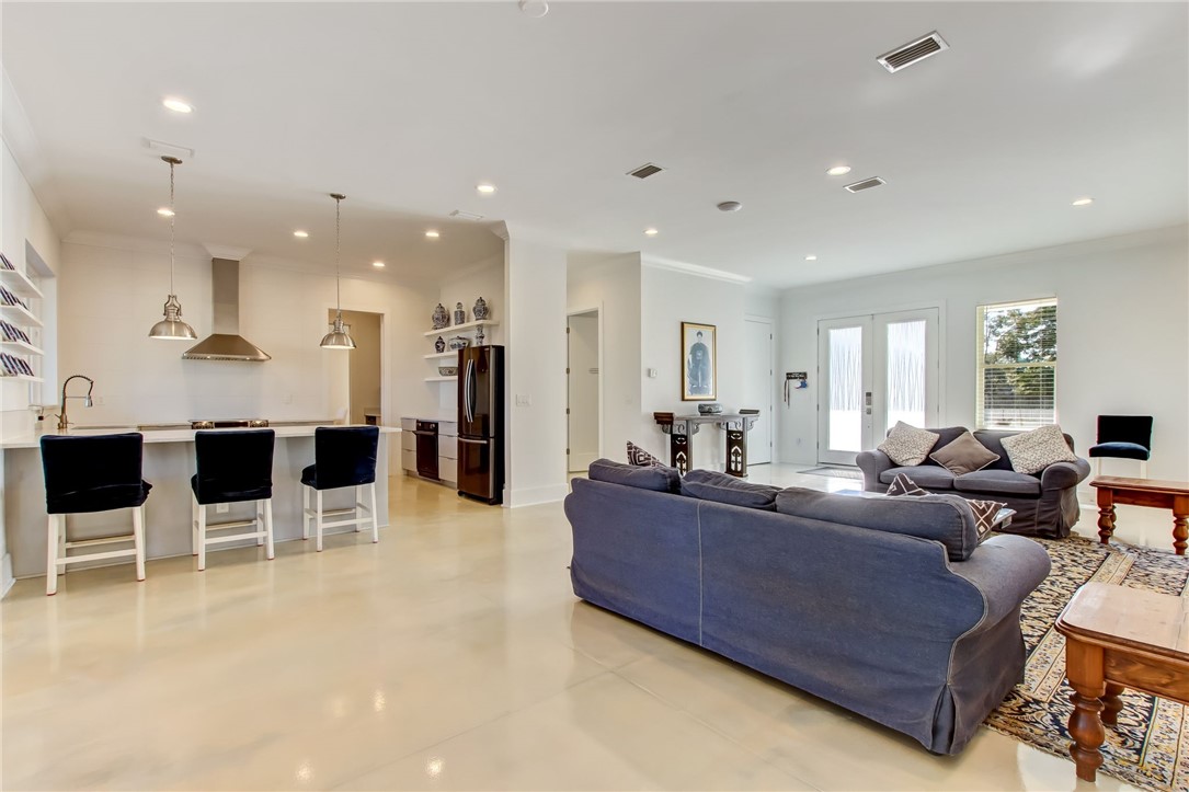 521 Bonnieview Road Fernandina Beach, FL 32034 - Photo 7 of 35 a living room with furniture a large window and kitchen view