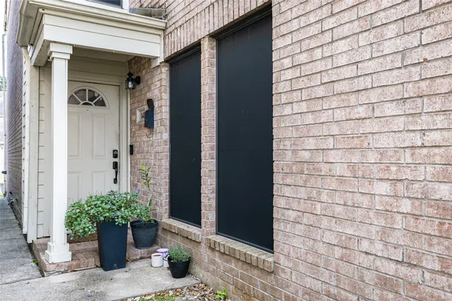 a view of potted plants in front of door