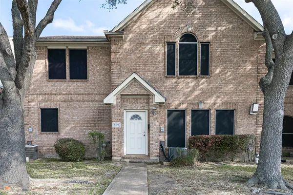 a front view of a house with garage