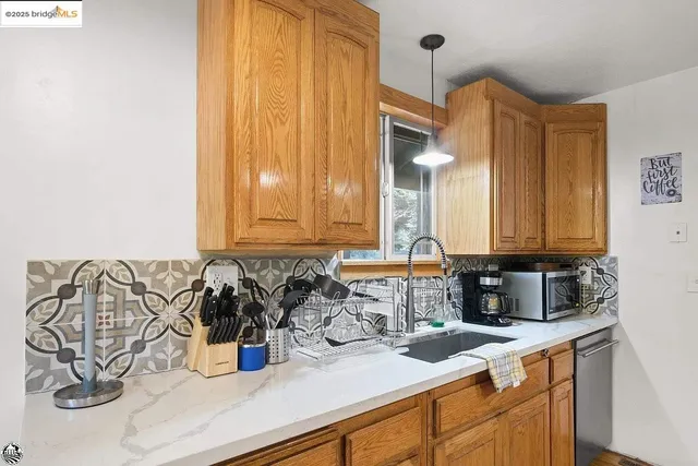 a kitchen with a sink and cabinets