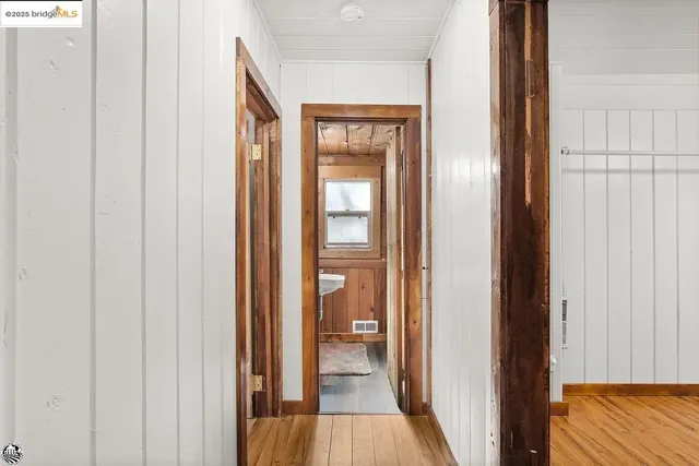 a view of a bathroom from a hallway