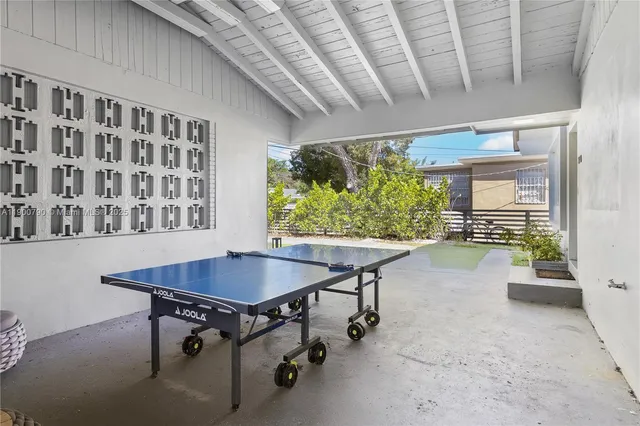 a dining room with a table and chairs