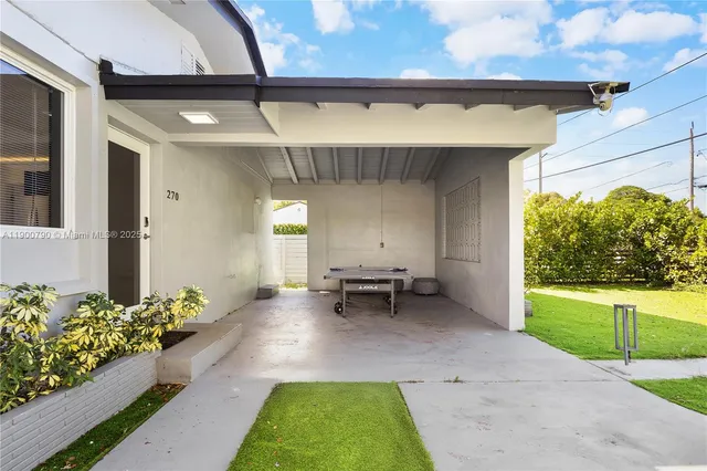 a backyard of a house with outdoor seating