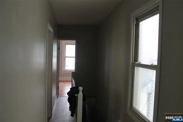 a view of hallway with windows