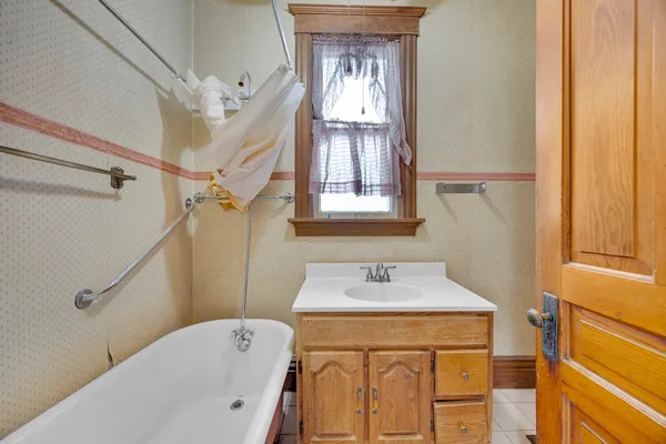 a kitchen with a stove sink and cabinets