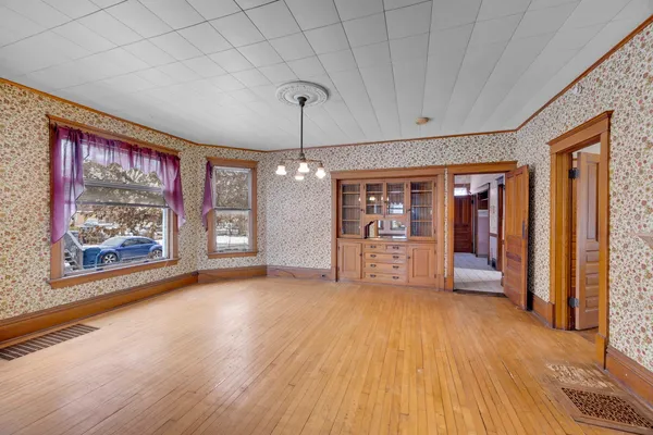 a view of an entryway with wooden floor