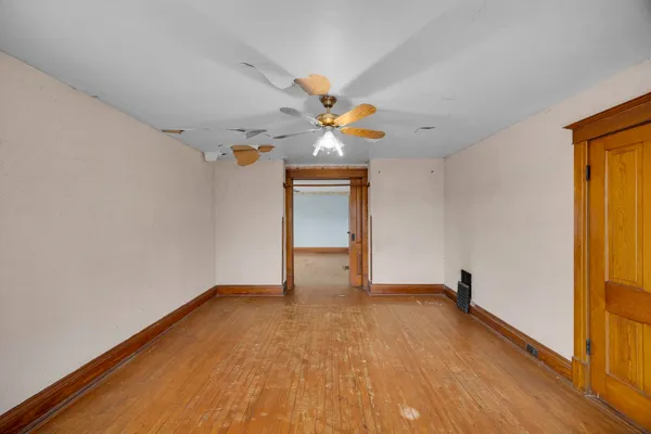 a view of livingroom with hardwood floor and ceiling fan