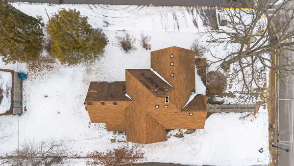 a view of a house with a snow