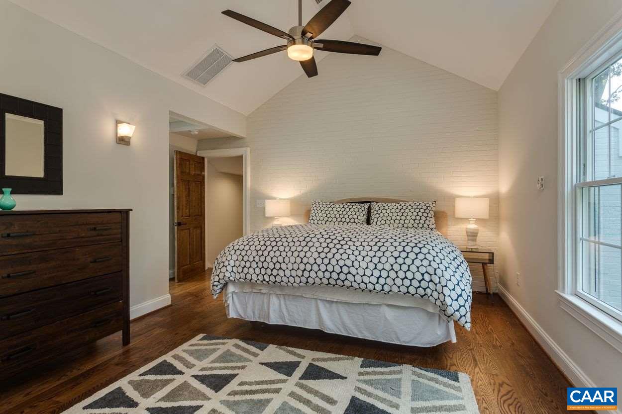 316 Kent Road Charlottesville, VA 22903 - Photo 26 of 47 a bedroom with a bed and wooden floor