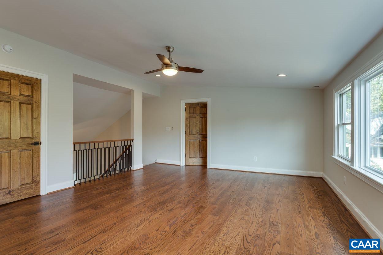 316 Kent Road Charlottesville, VA 22903 - Photo 35 of 47 a view of an empty room with wooden floor and a window