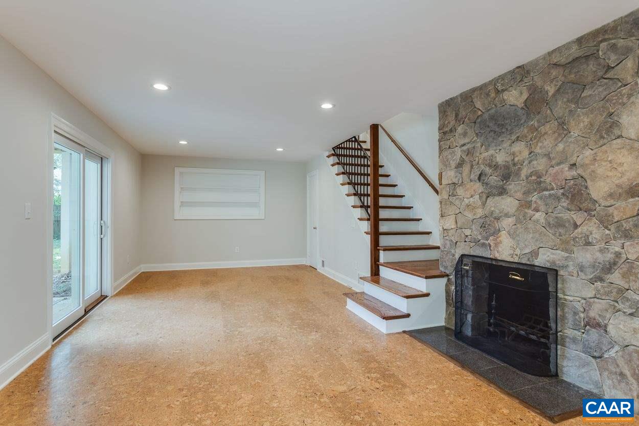 316 Kent Road Charlottesville, VA 22903 - Photo 41 of 47 a view of an empty room with stairs and wooden floor