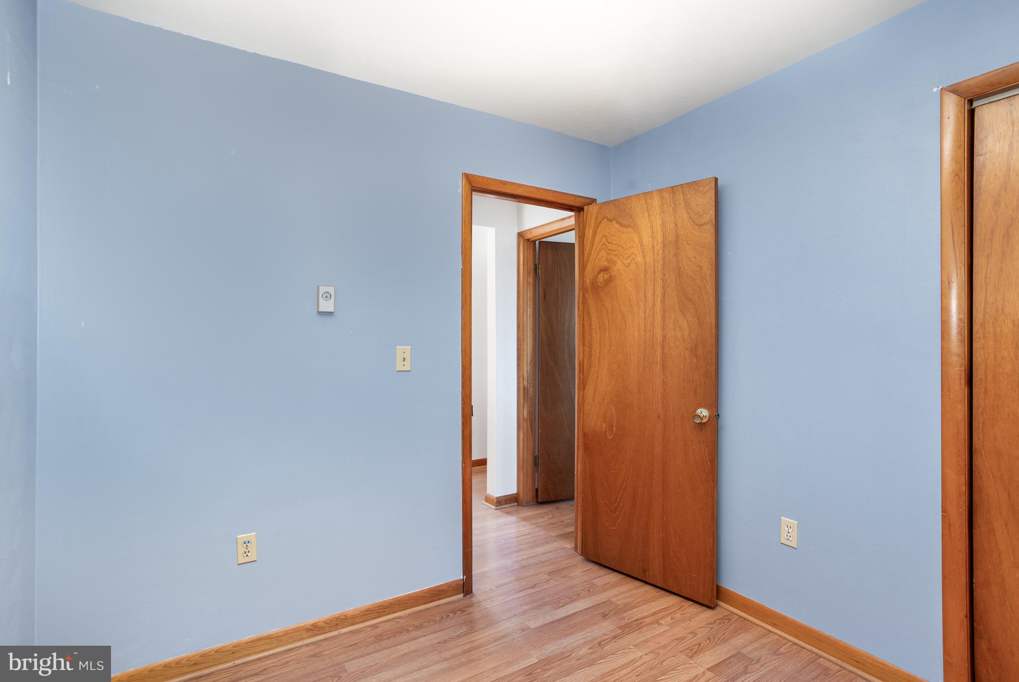 1487 Kbs Road Spring Grove, PA 17362 - Photo 19 of 35 a view of an empty room with wooden floor and a window