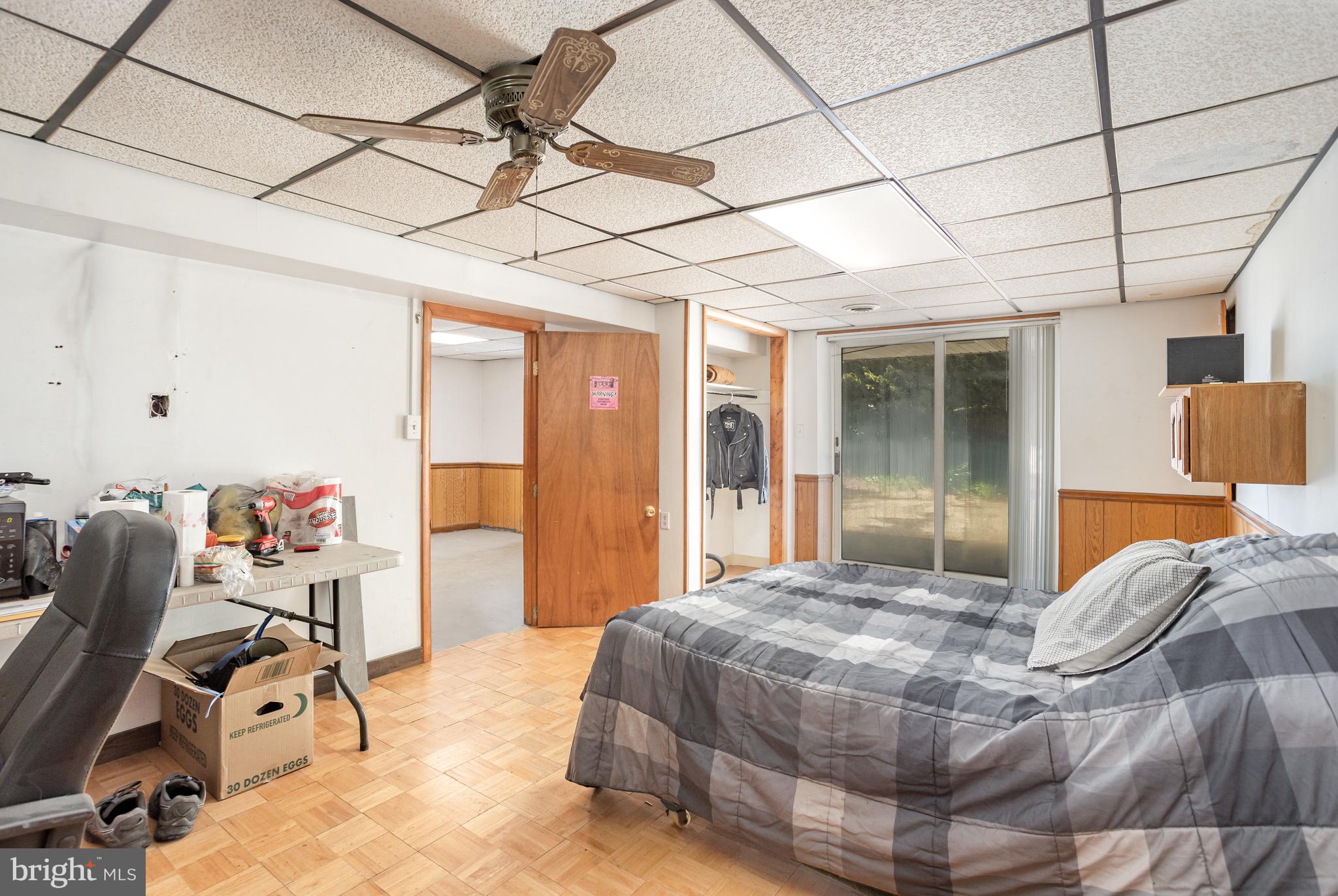 1487 Kbs Road Spring Grove, PA 17362 - Photo 23 of 35 a bedroom with a bed a desk and chair with the view of chandelier