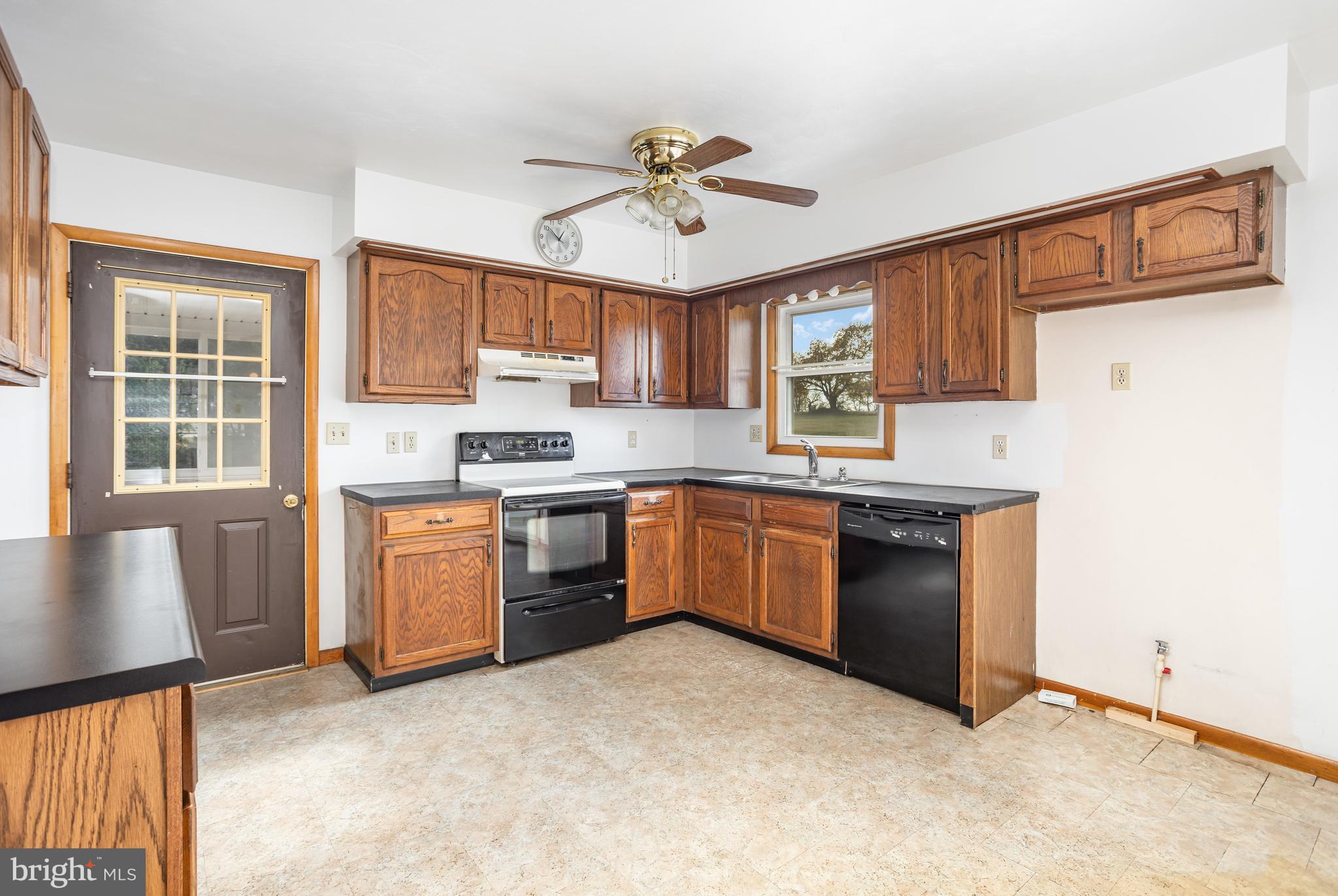 1487 Kbs Road Spring Grove, PA 17362 - Photo 9 of 35 a kitchen with granite countertop a stove cabinets and a sink