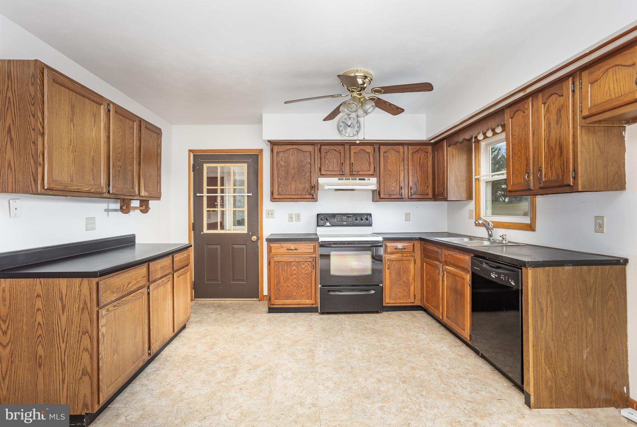 1487 Kbs Road Spring Grove, PA 17362 - Photo 10 of 35 a kitchen with stainless steel appliances granite countertop a stove sink microwave and refrigerator