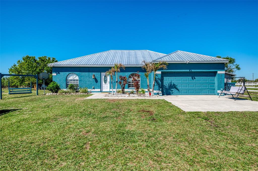 2700 Verna Bethany Road Myakka City, FL 34251 - Photo 11 of 61 a view of a house with a yard patio and fire pit