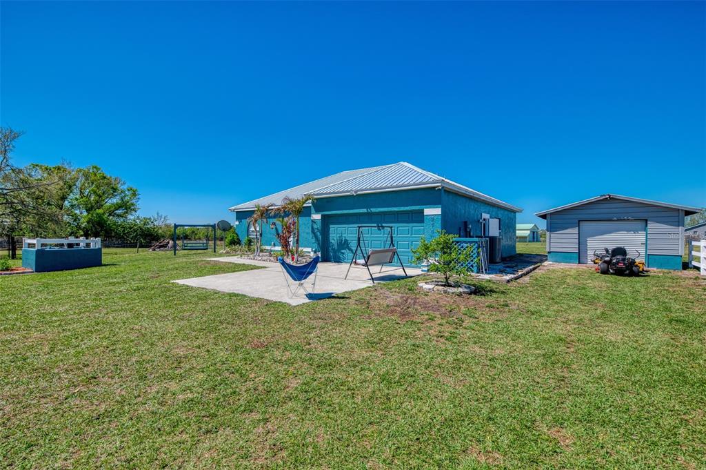 2700 Verna Bethany Road Myakka City, FL 34251 - Photo 12 of 61 a view of a house with backyard porch and sitting area