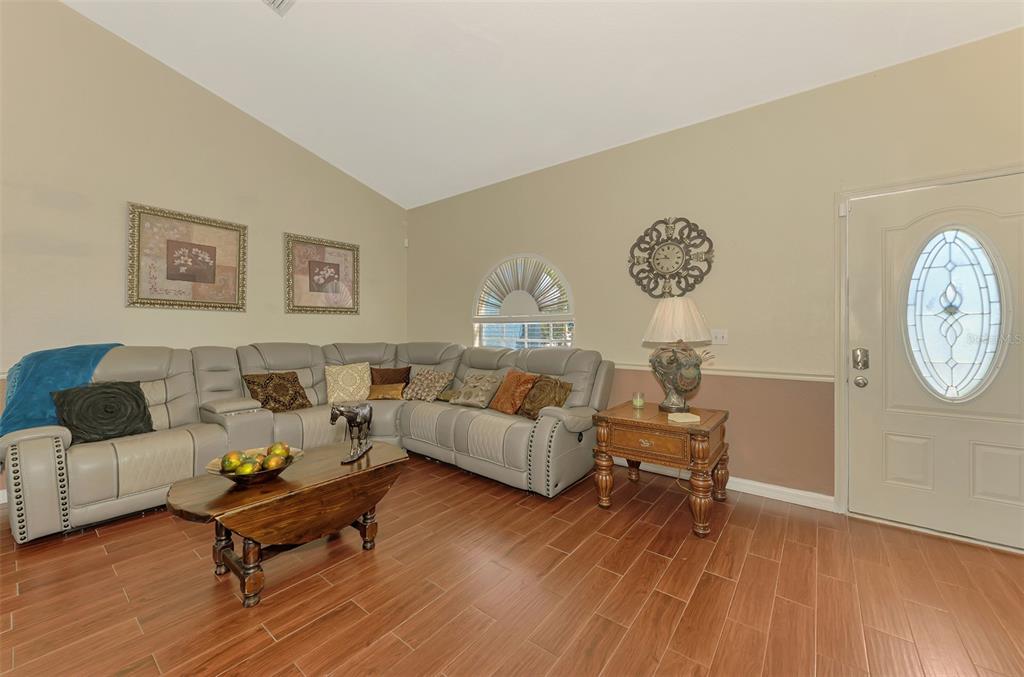 2700 Verna Bethany Road Myakka City, FL 34251 - Photo 14 of 61 a living room with furniture and a wooden floor