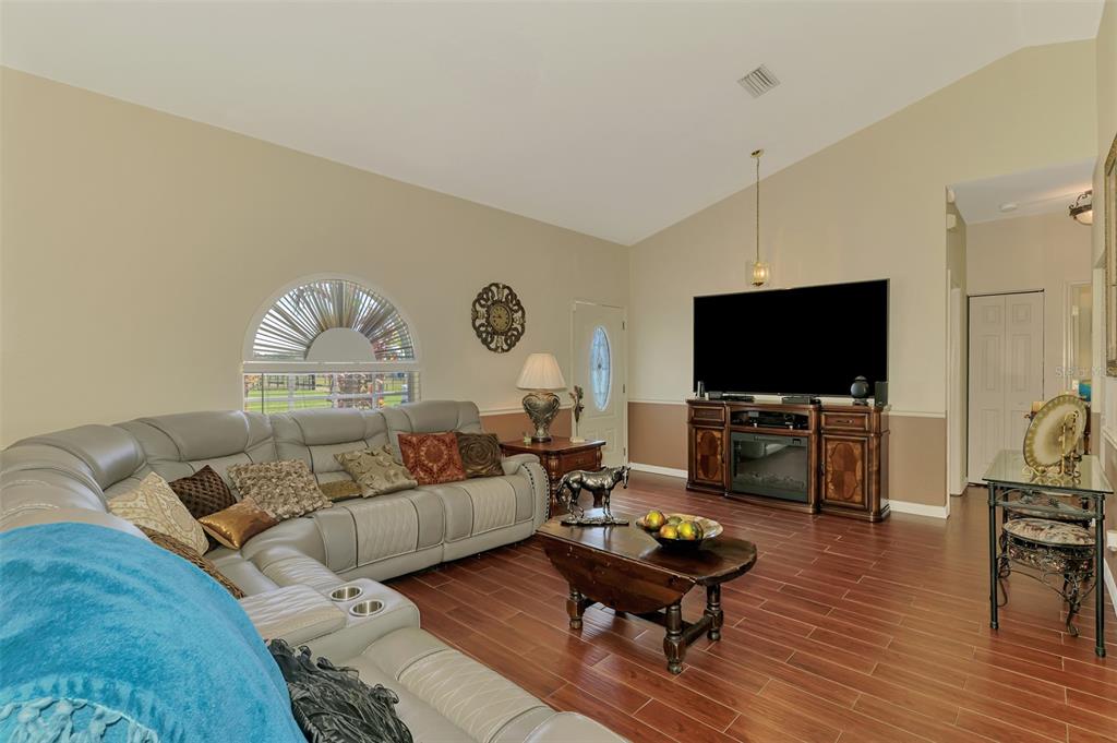 2700 Verna Bethany Road Myakka City, FL 34251 - Photo 16 of 61 a living room with furniture and a flat screen tv