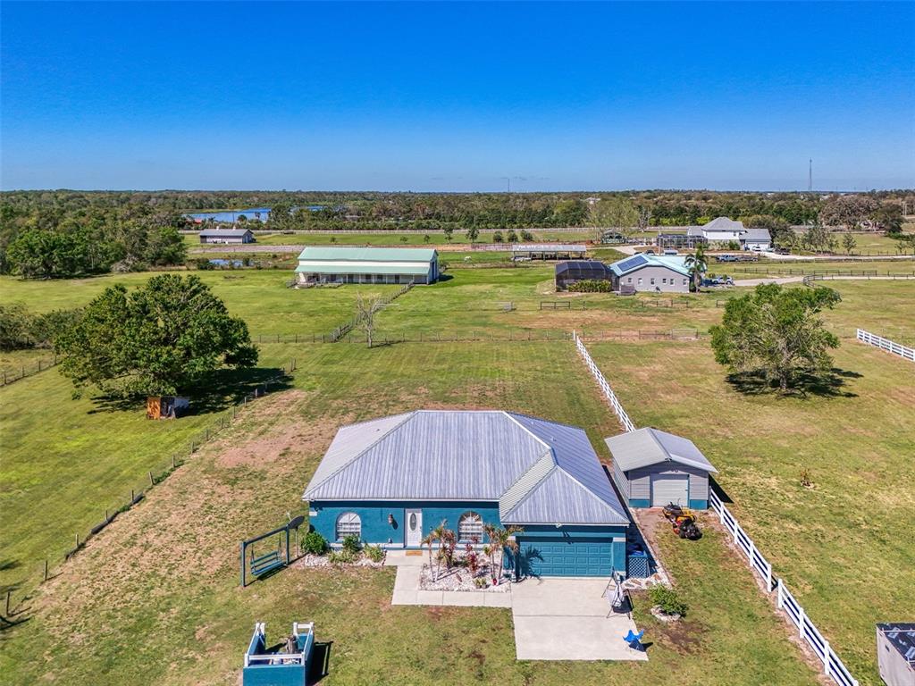 2700 Verna Bethany Road Myakka City, FL 34251 - Photo 2 of 61 an aerial view of a house with a ocean view