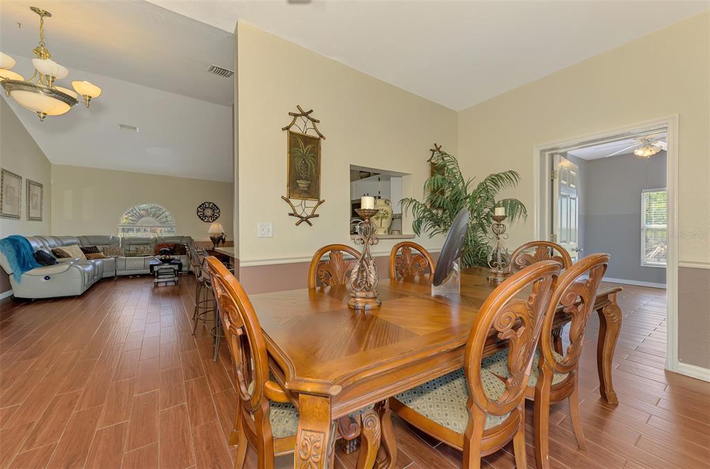 2700 Verna Bethany Road Myakka City, FL 34251 - Photo 23 of 61 a dining room with furniture and wooden floor