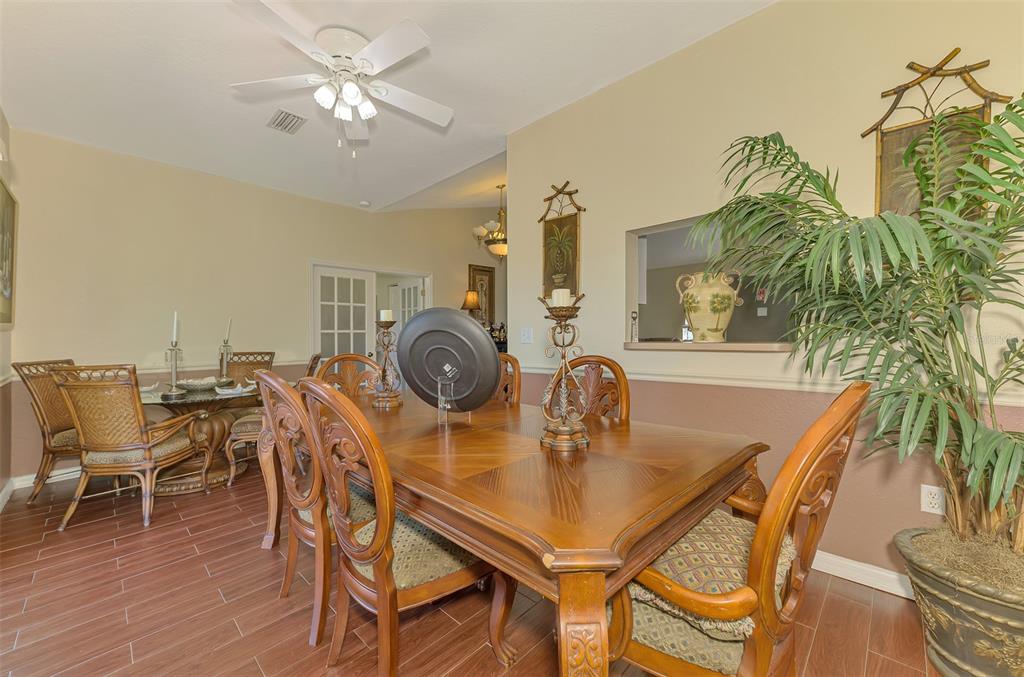 2700 Verna Bethany Road Myakka City, FL 34251 - Photo 24 of 61 a view of a dining room with furniture and wooden floor