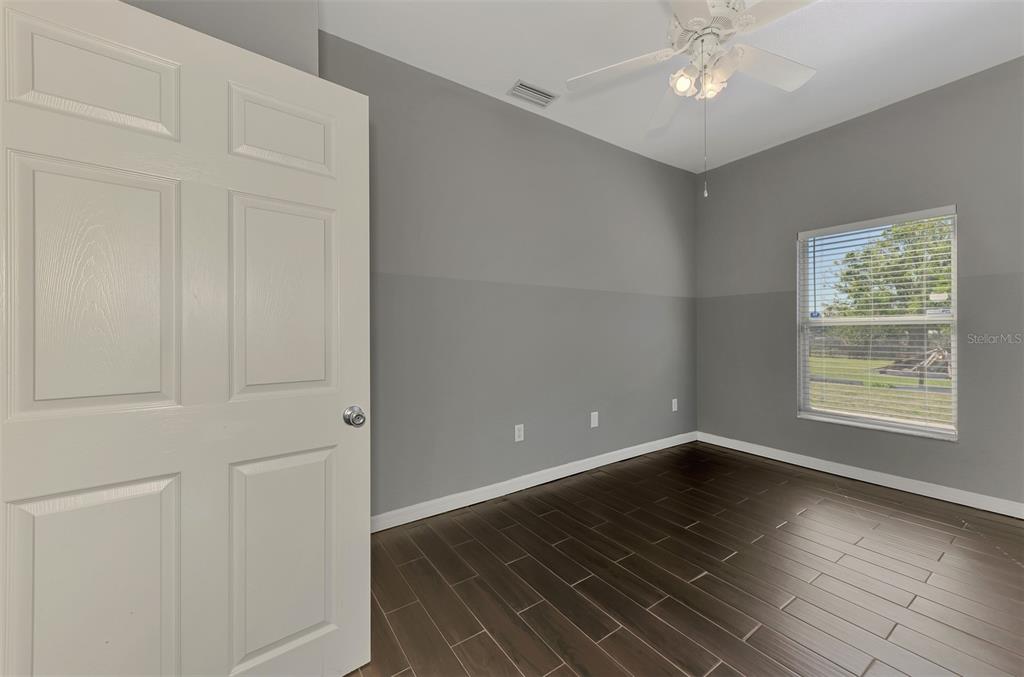 2700 Verna Bethany Road Myakka City, FL 34251 - Photo 36 of 61 wooden floor in an empty room with a window