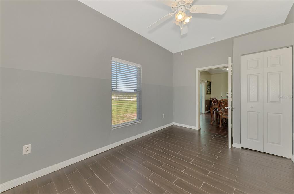 2700 Verna Bethany Road Myakka City, FL 34251 - Photo 37 of 61 wooden floor in an empty room with a window