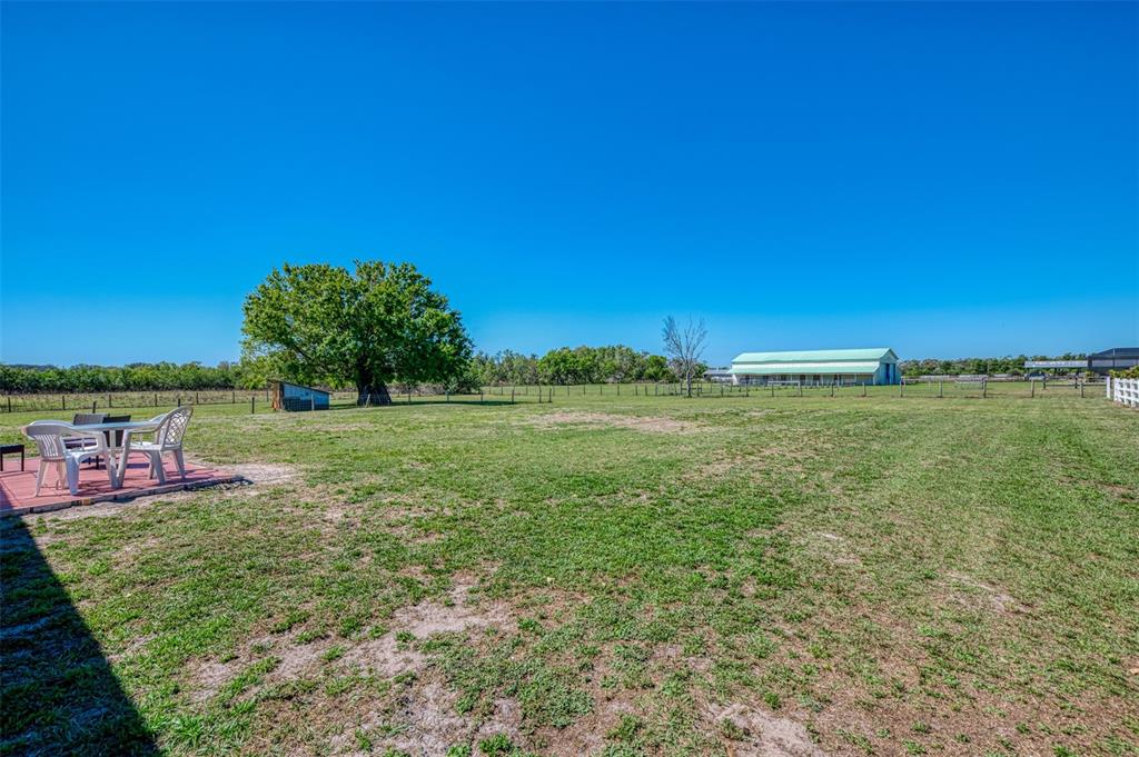 2700 Verna Bethany Road Myakka City, FL 34251 - Photo 39 of 61 a view of a garden with a building in the background