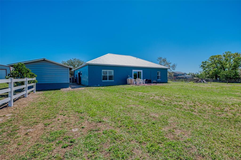 2700 Verna Bethany Road Myakka City, FL 34251 - Photo 40 of 61 a view of a house with a yard and sitting area