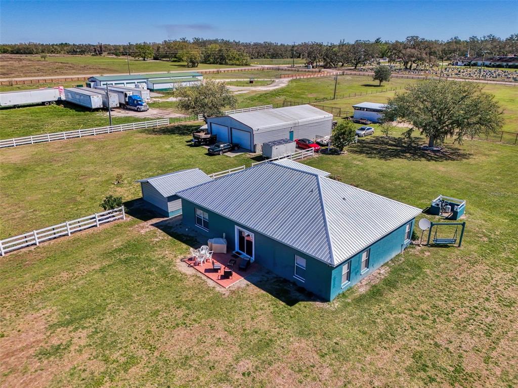 2700 Verna Bethany Road Myakka City, FL 34251 - Photo 57 of 61 a aerial view of a house with outdoor space and lake view