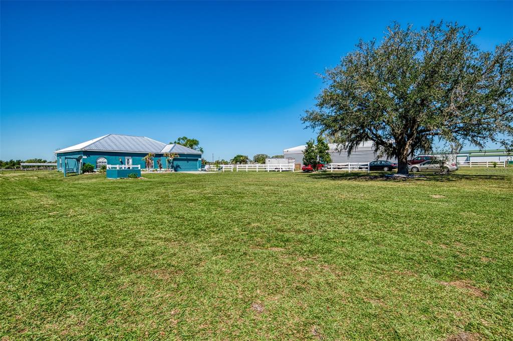 2700 Verna Bethany Road Myakka City, FL 34251 - Photo 9 of 61 a view of a house with a yard