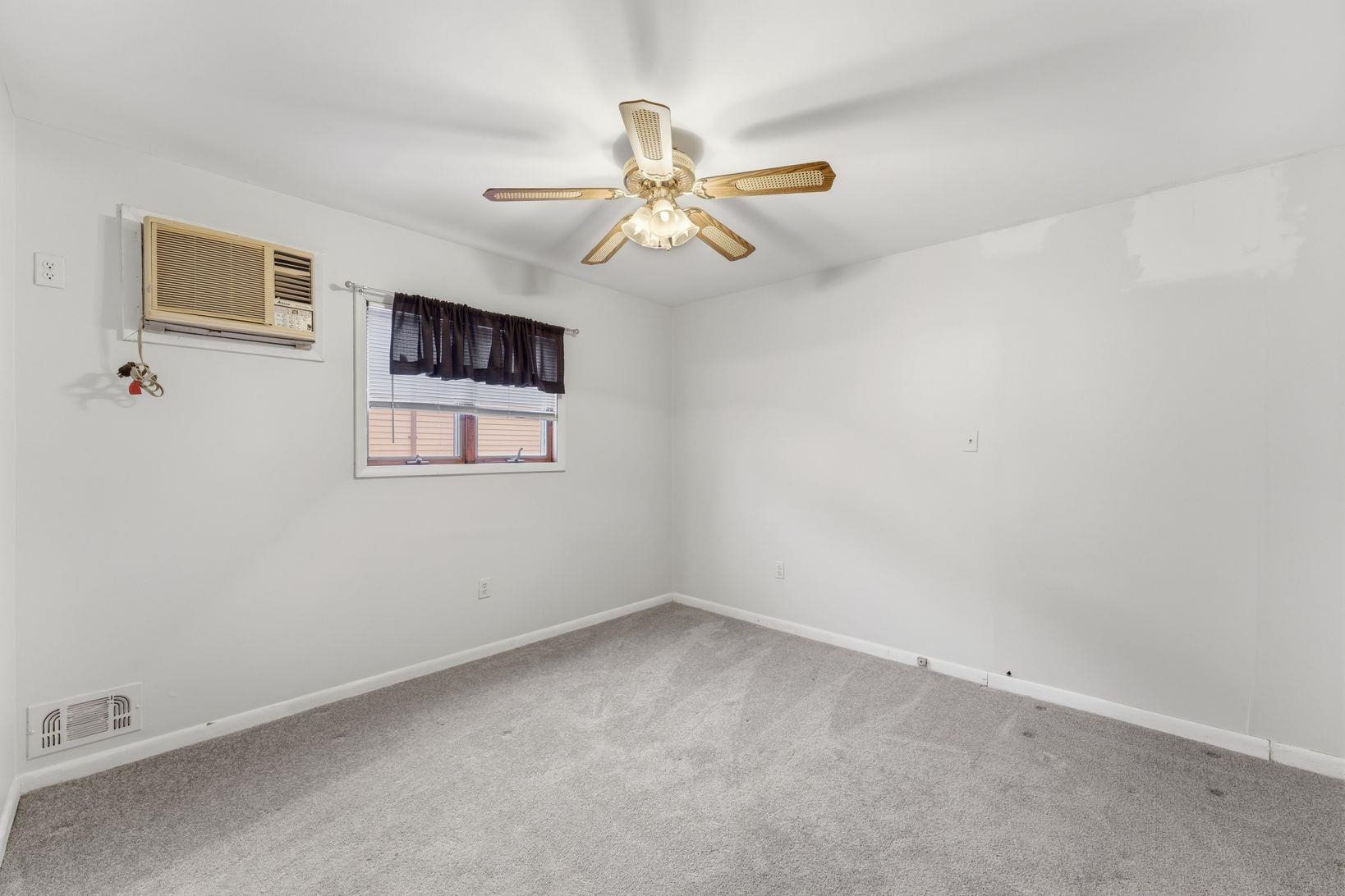 229 Centre Avenue Secaucus, NJ 07094 - Photo 24 of 40 an empty room with windows and fan