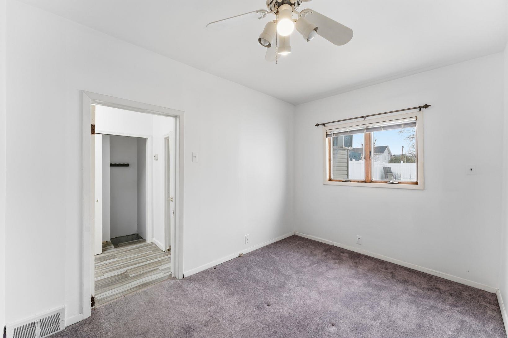 229 Centre Avenue Secaucus, NJ 07094 - Photo 26 of 40 wooden floor in an empty room with a window