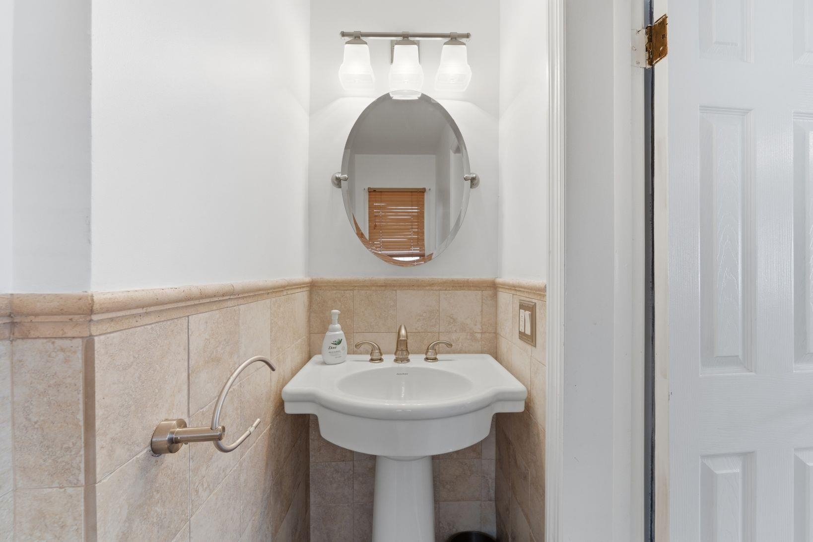 229 Centre Avenue Secaucus, NJ 07094 - Photo 28 of 40 a bathroom with a sink and a mirror