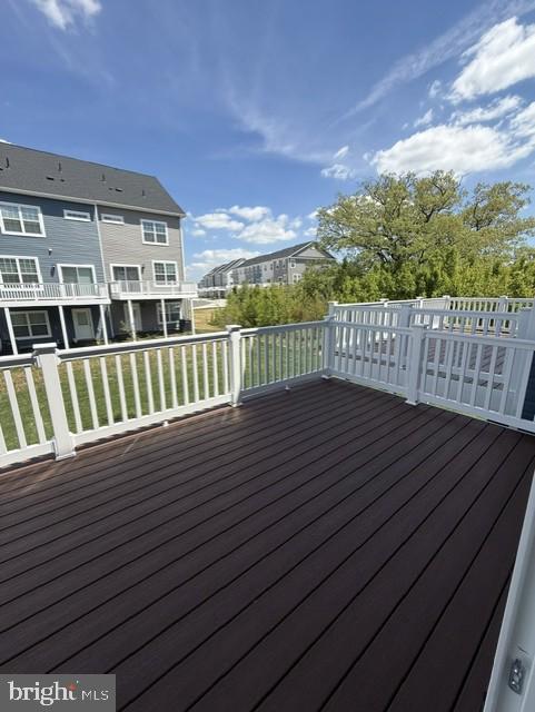 7608 River Reach Road Baltimore, MD 21244 - Photo 9 of 14 a view of a balcony with wooden floor