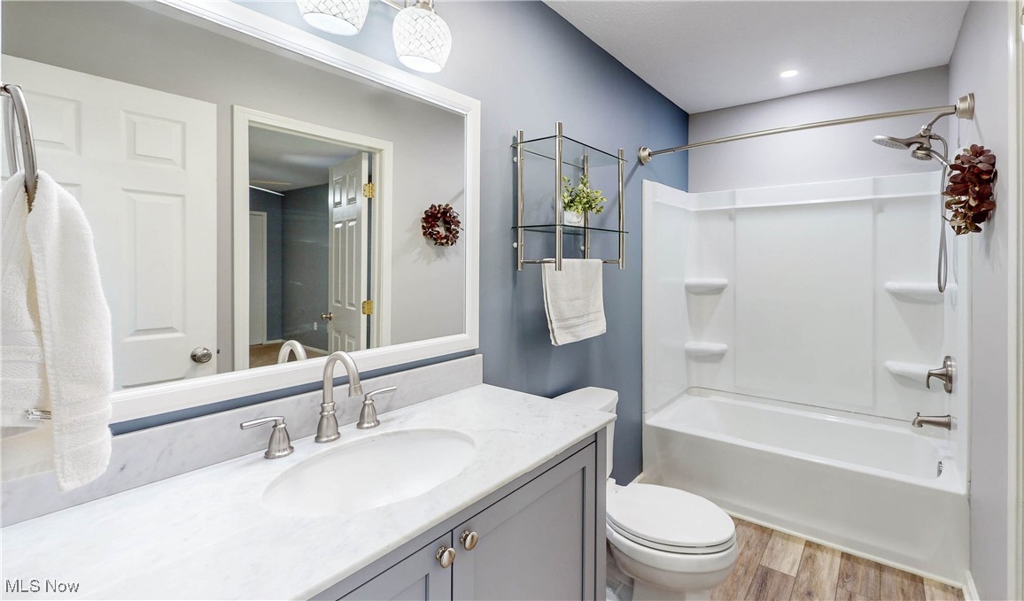 3491 Kent Road Stow, OH 44224 - Photo 19 of 40 Full bathroom with shower / bathtub combination, toilet, large vanity and waterproof LVT flooring