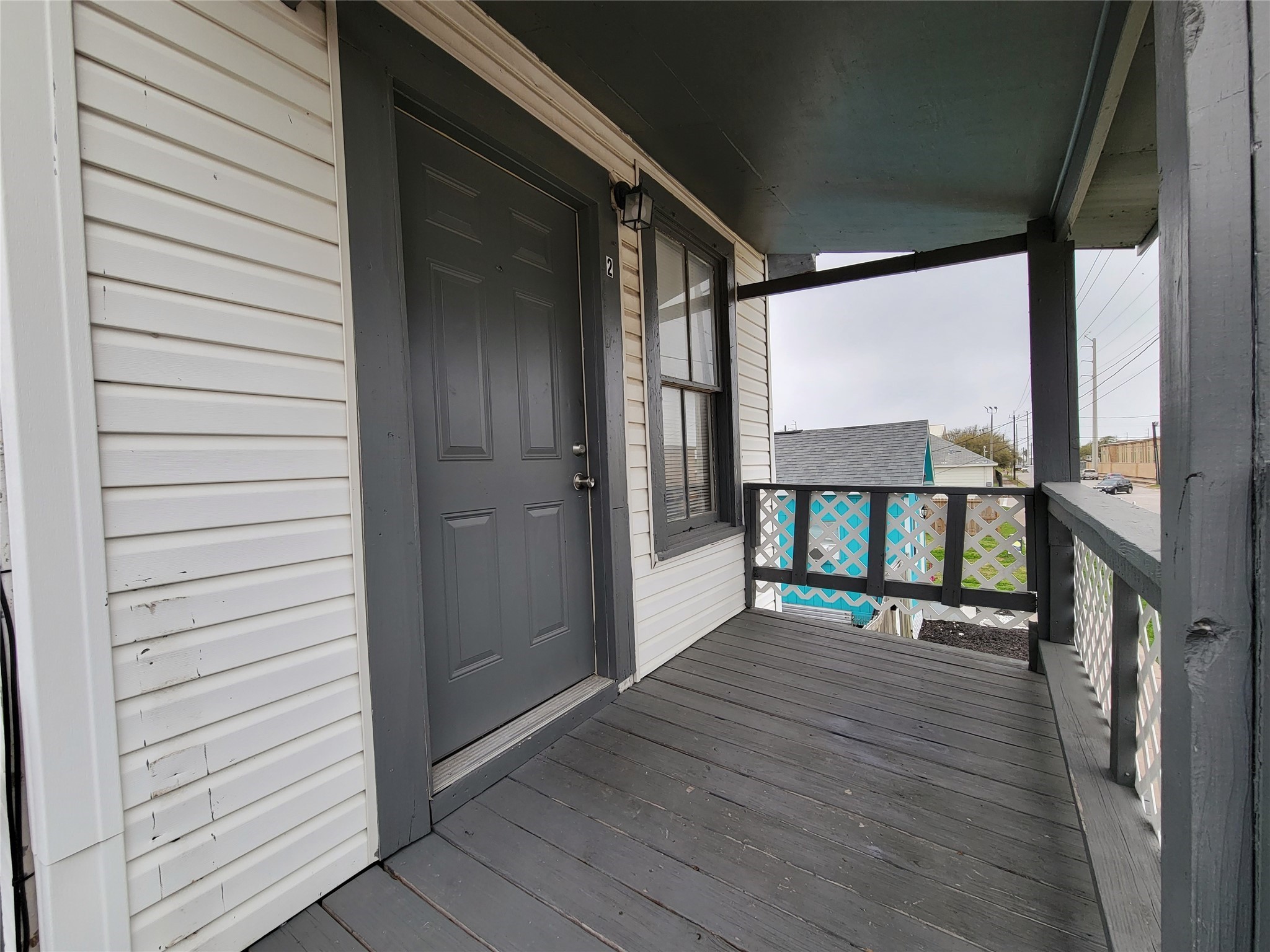 3913 Winnie Street, Unit UP Galveston, TX 77550 - Photo 7 of 9 a porch with a table and chairs