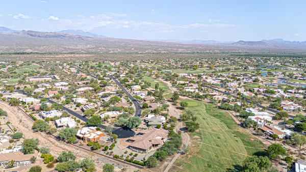 an aerial view of residential houses with outdoor space