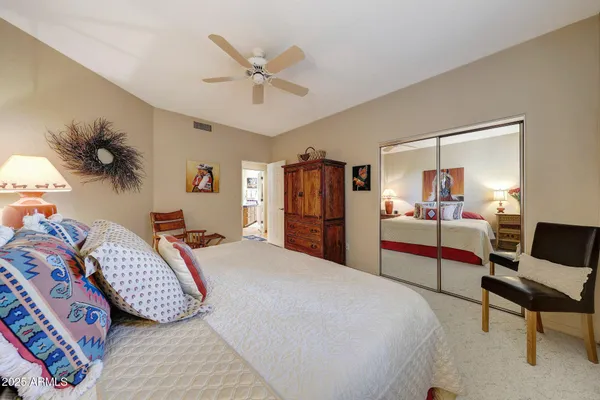 a kitchen with stainless steel appliances kitchen island granite countertop a refrigerator and microwave