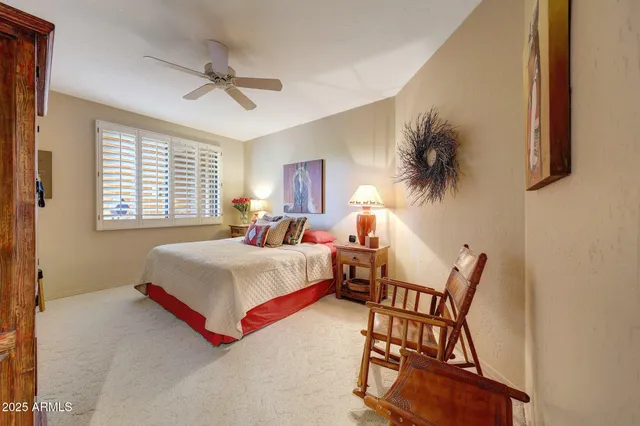 a kitchen with stainless steel appliances kitchen island granite countertop a table and chairs in it