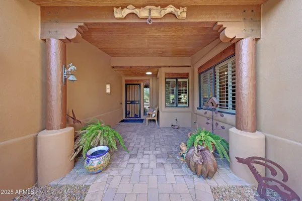 a living room with lots of furniture and a chandelier
