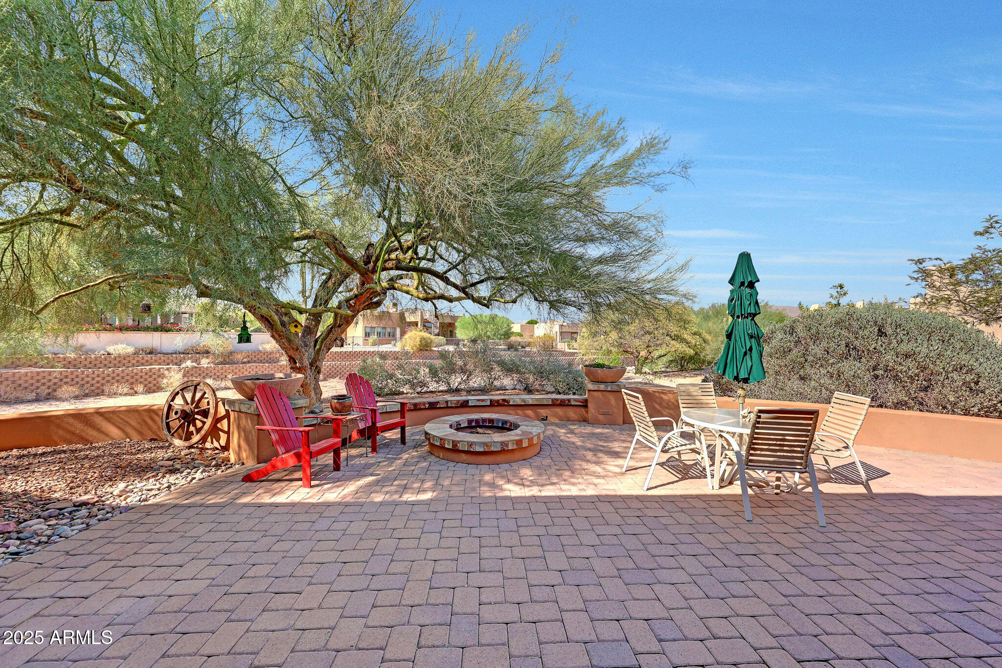 18610 East Gemmill Drive Rio Verde, AZ 85263 - Photo 34 of 53 a view of a patio with table and chairs and potted plants